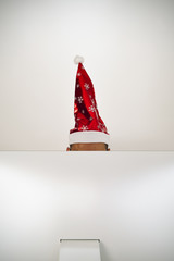 man with a santa hat in his office
