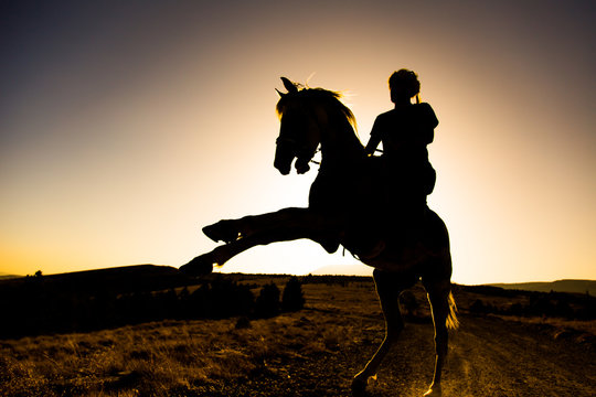the man riding the skyline at sunset