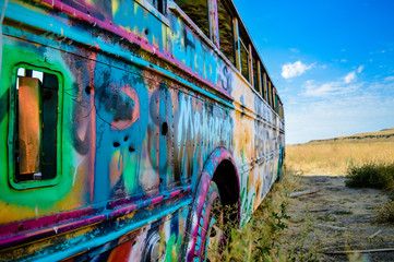 Abandoned and colorful graffiti bus.