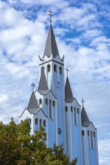 Fototapeta na wymiar Interesting, modern, blue church in the village Heviz of Hungar
