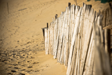 Wooden fence on Atlantic beach in France