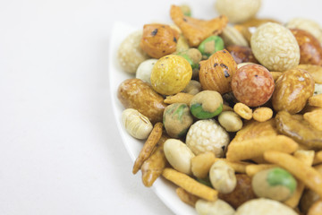 Fototapeta premium Mixed snacks rice, nuts and dried green beans