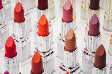 Set of color lipsticks on white background