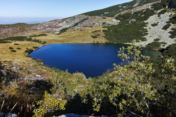 Landscape with green hills and Yonchevo lake, Rila Mountain, Bulgaria