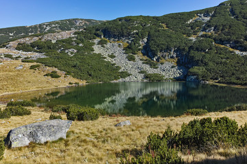 Landscape with green hills and Yonchevo lake, Rila Mountain, Bulgaria