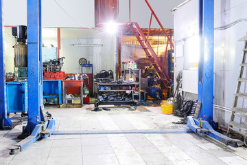 Car under repair in a car repair station