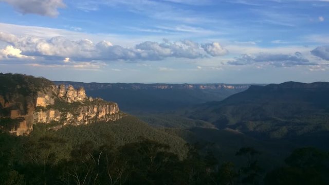 Timelapse landscape of The Three Sisters rock formation in the Blue Mountains of New South Wales, Australia, on the north escarpment of the Jamison Valley.