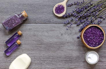 organic cosmetics with lavender on wooden background top view