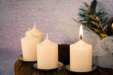 burning candle in advent decoration