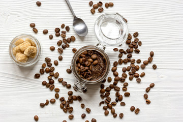 jar coffee-chocolate scrub top view on wooden table