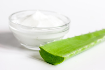 aloe vera - leaves and cream isolated on white background