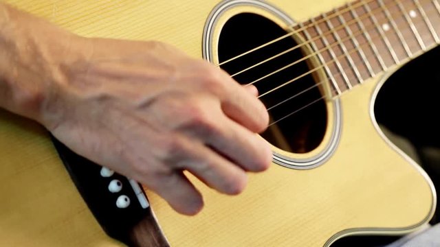 Musician playing - practicing guitar, close up; 