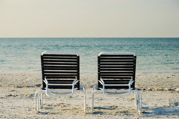 Two Beach Chairsv in front of ocean, retro style