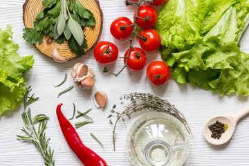 tomato with salad and garlic on wooden background top view