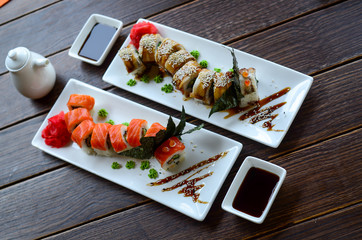 Tasty sushi rolls with sauce