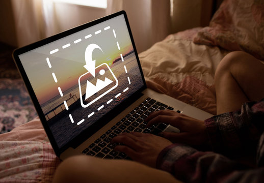 User with Laptop in Bed Mockup
