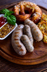 Tasty sausages with vegetables and sauce
