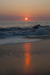 Guatemala. pacific ocean. Silhouette of the fisherman or leisure boat sailing toward golden sunset with saturated sky and clouds. Beautiful seascape in the evening.