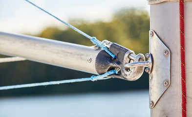 The spinnaker pole is rigged to run from the base of the mast to windward over the side of the boat.