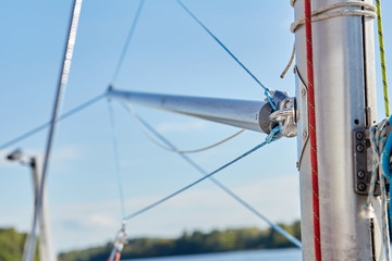 The spinnaker pole is rigged to run from the base of the mast to windward over the side of the boat.