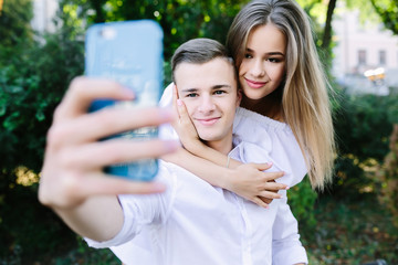 Beautiful young couple makes selfie