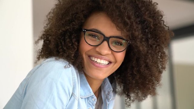 Portrait of attractive mixed-race woman with eyeglasses
