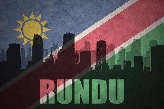 abstract silhouette of the city with text Rundu at the vintage namibian flag