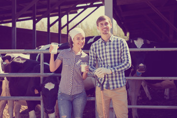 Man and woman having glass of fresh milk