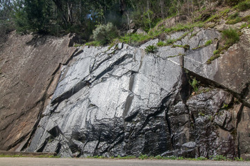 Natural waterfall in the mountains roads