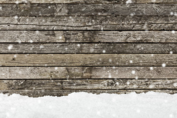 snow on a wooden fence as background image