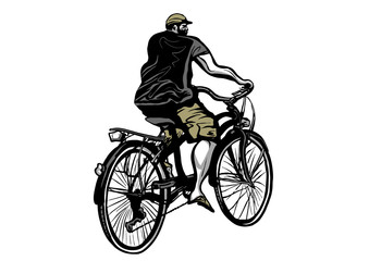 Young man riding a bicycle ride in summer clothes seen from side