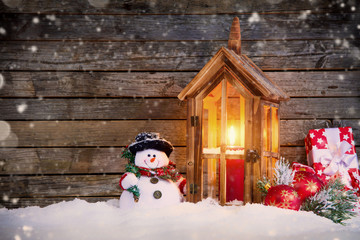 Christmas background with snowman and lantern