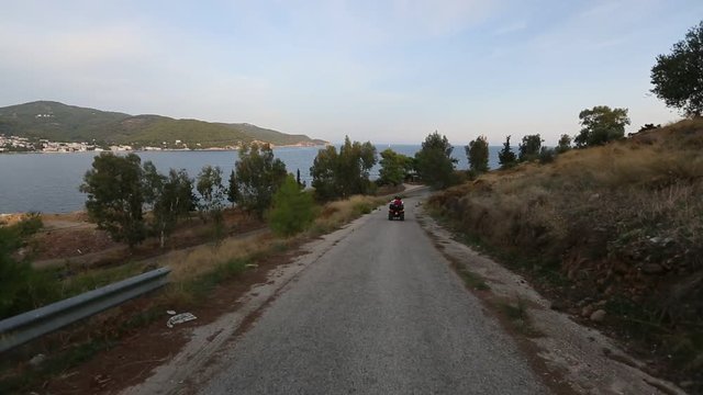 Riding on the serpentine roads of Poros island, Greece.