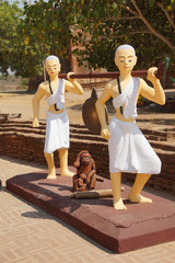 monks carrying large gong