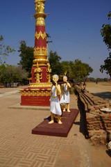 monks carrying large gong