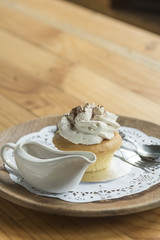 sweet cupcake with whip cream and chocolate