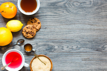 Fruit tea with lemon, milk,honey,orange, pomegranate, on a woode