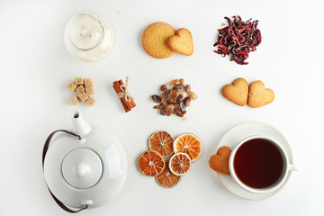 Tea set on white background, flat lay