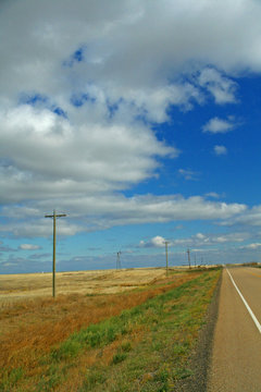 Telephone Poles On Open Prairies, With Big Blue Sky Alberta,Canada