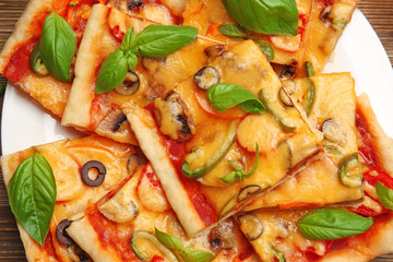 Delicious pizza slices on plate