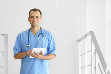 Doctor with tablet at hospital