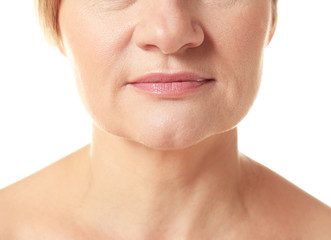 Obraz premium Face of senior adult woman on white background