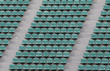 green spectator seats at a football stadium