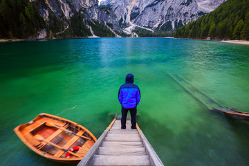 Man alone at the Braies Lake, Italy
