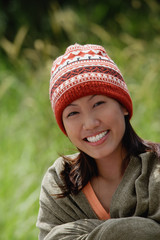 Woman with ski cap, wrapped in a blanket