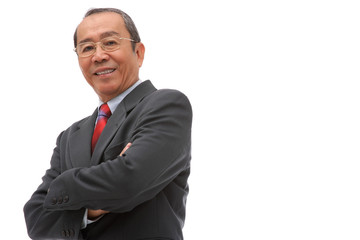 Businessman looking at camera, arms crossed