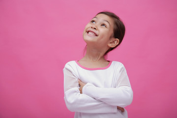 Girl with arms crossed, looking away