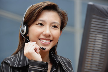 Female executive with hands free device