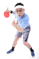Man playing ping pong, preparing to serve