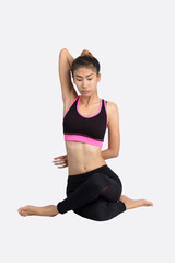 Young woman in yoga pose.
